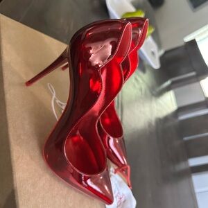 Never used Christian Louboutin Red Pumps